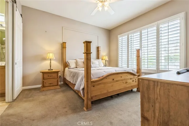 The Primary Bedroom has plenty of room for even large pieces of furniture. Barn door has been installed between the bedroom and bathroom for privacy.