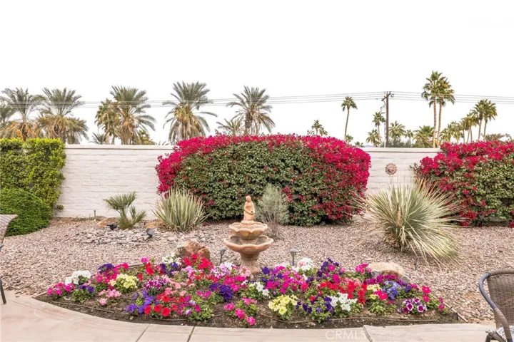 Pretty planted area and fountain. Hazy day, usually a pretty view of the Shadow Hills from here :-)