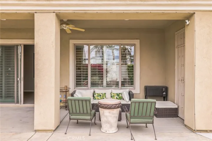 Covered patio has a ceiling fan and misters for enjoying the evening breezes and stars over the Shadow Hills.