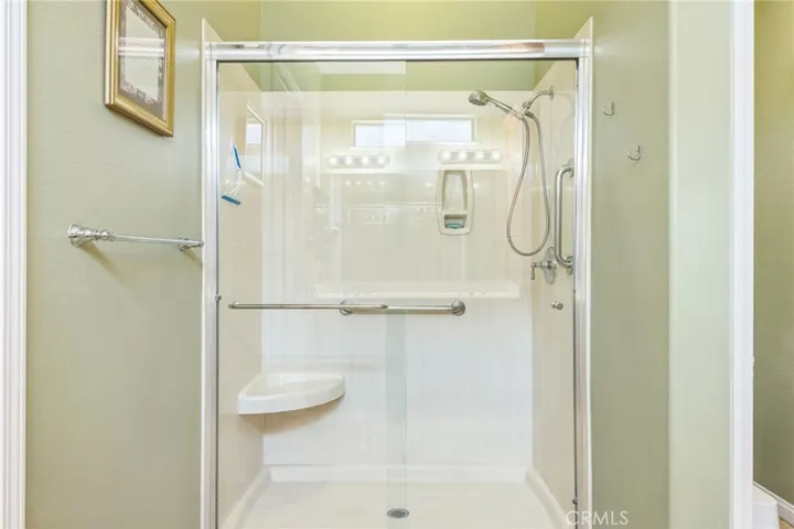 Walk-in shower with seat.