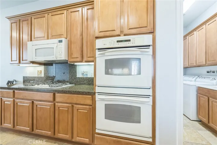 Gas cooktop, microwave and double ovens. Top oven is convection and conventional.