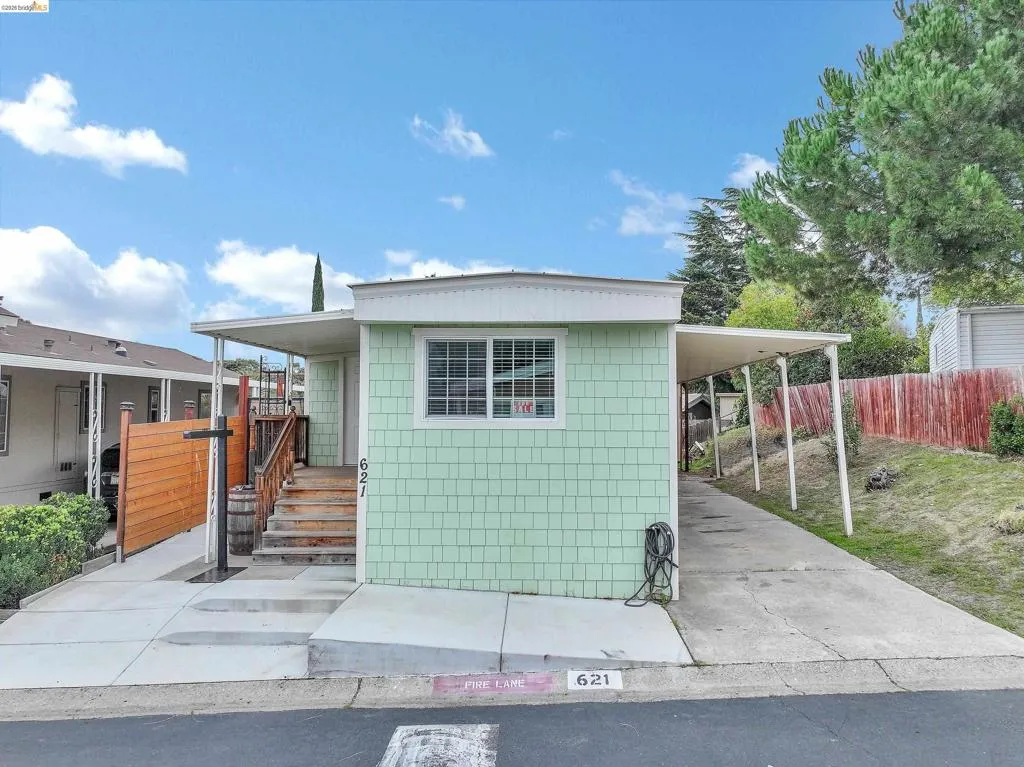 View of front facade with an attached carport
