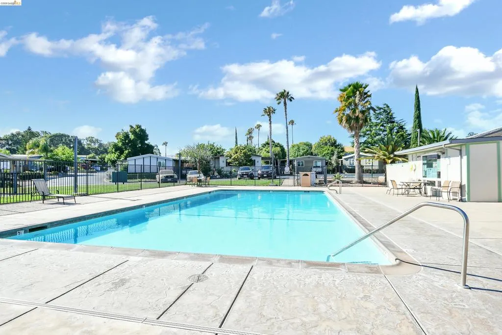 Community pool featuring a patio area