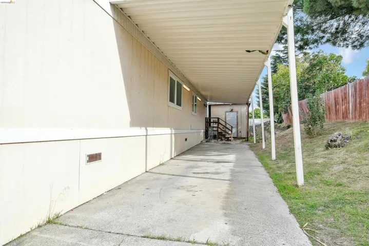 View of patio with a carport