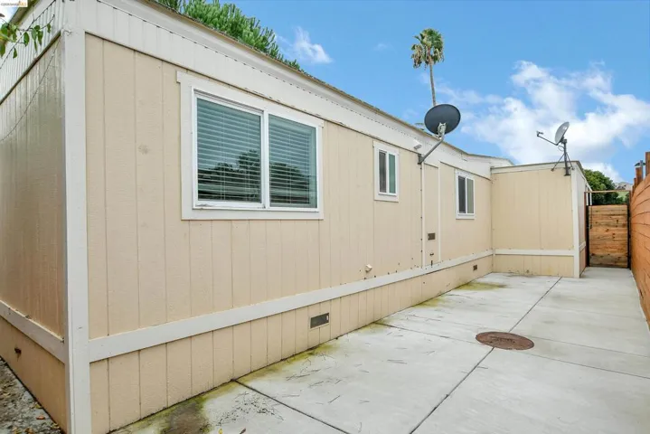View of side of home with crawl space