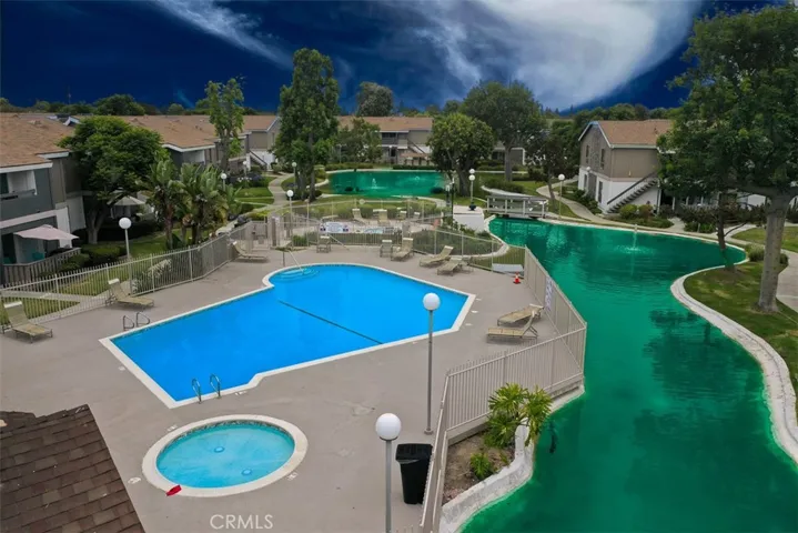 Enjoy the pool, spa and lake.