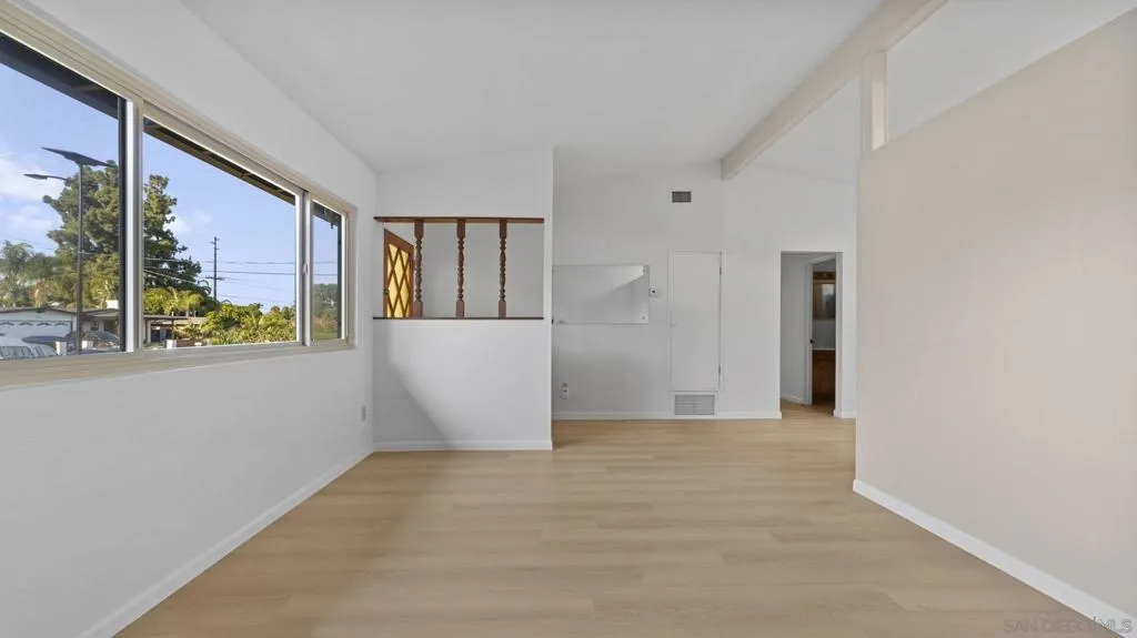 Standing in the Living Room and looking toward the main entry door.