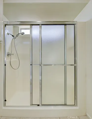 Shower in right-side bathroom.