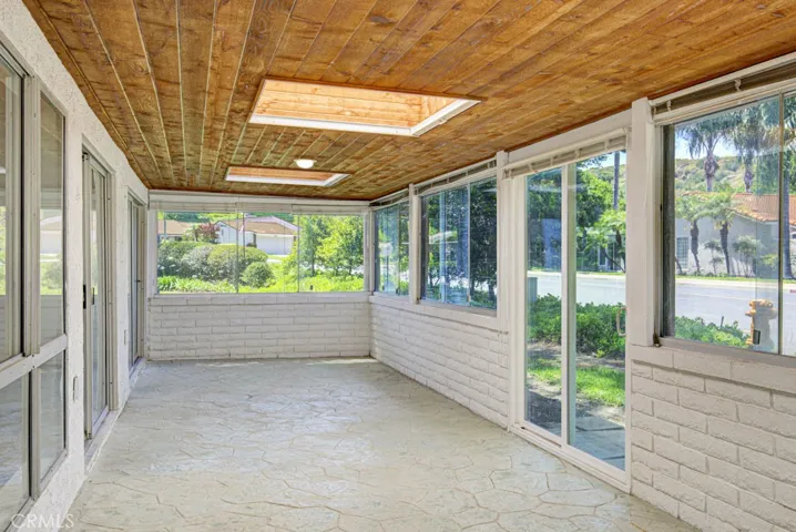 Large enclosed rear patio (not included in square footage) provides additional space for a variety of indoor uses.