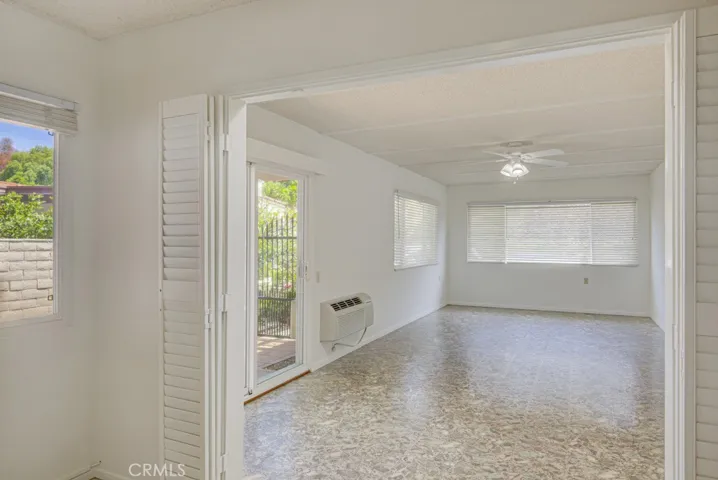 Enormous bonus room measures approximately 300 sq. ft. This versatile space has direct access to the front patio via a glass slider and could be used as a TV room, office, home gym or arts and crafts studio.