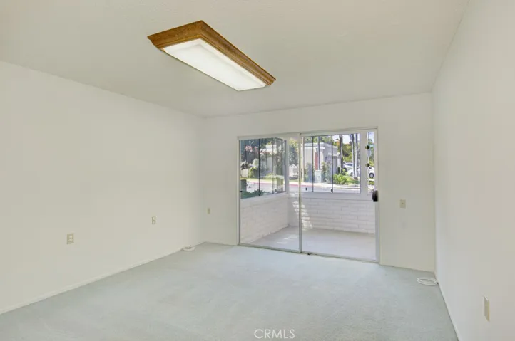 Left-side primary bedroom has direct access to the enclosed rear patio.
