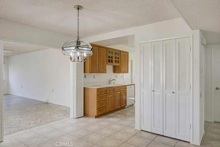 View of the entry to the kitchen from the dining room.