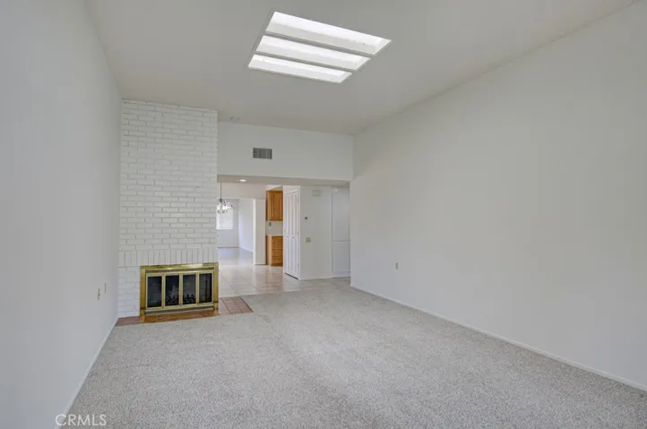 Another view of the living room. Entry to the kitchen can be seen in the background.