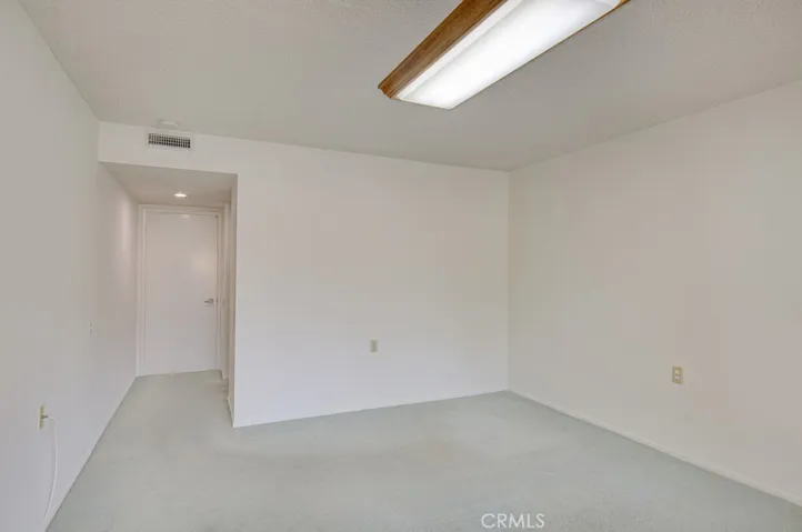 Another view of the left-side primary bedroom.