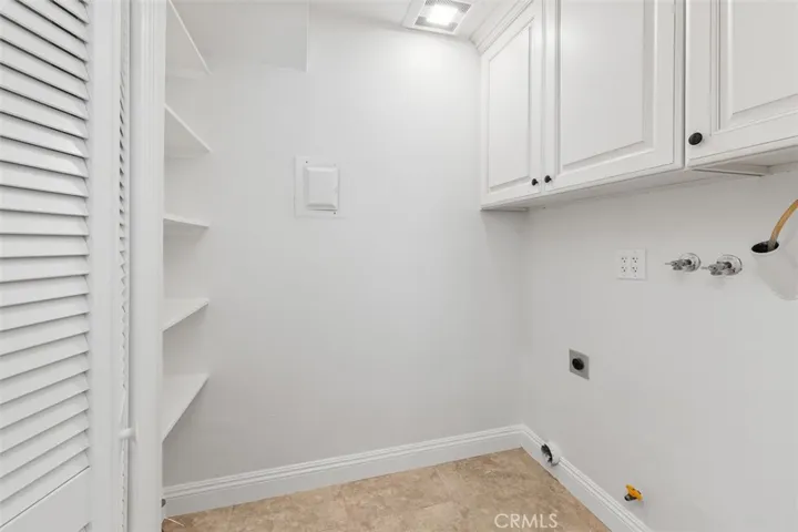 Laundry room with extra storage off the kitchen.