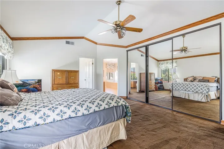 Primary Bedroom with Wall of Mirrored Closets