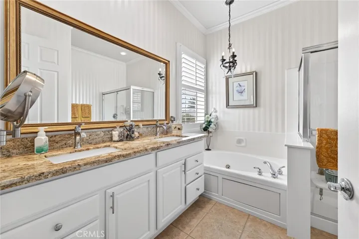 Primary Bathroom with Granite Countertops, Upgraded Cabinets, Double Sinks and Jetted Tub