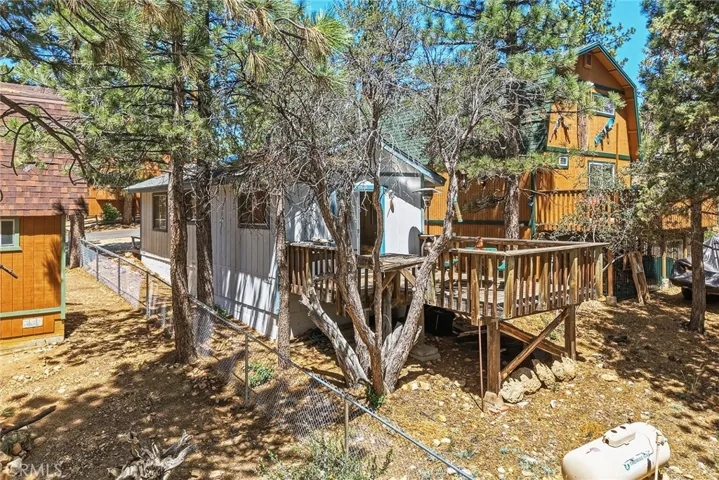Newer chain-link fence on one side and back of the property.