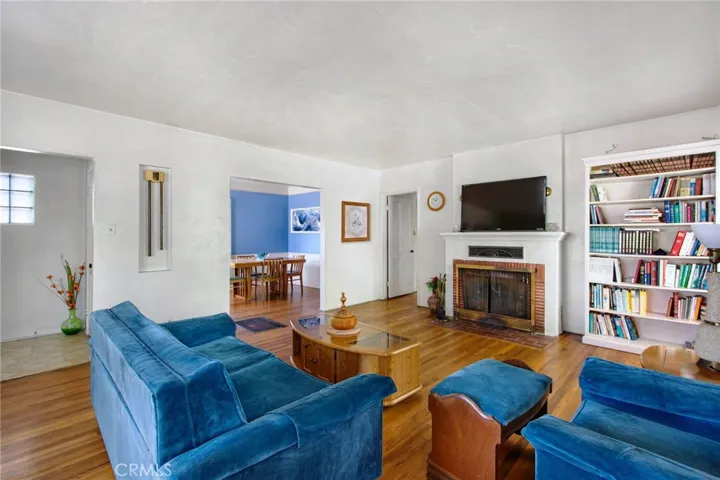 Entry at far left; living room looking toward dining room
