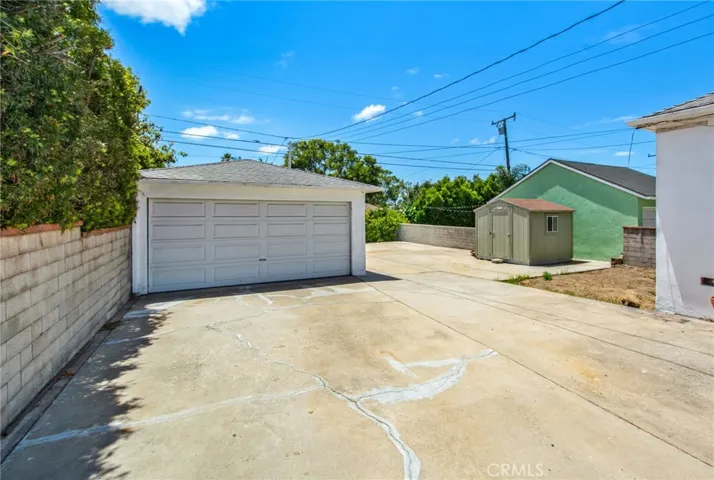 2-Car Garage & Ruff Shed (right); open patch of ground for grass or garden