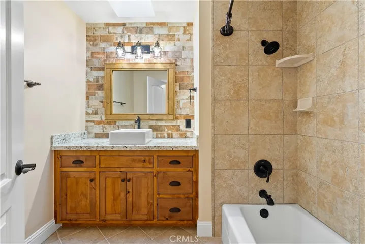 Hall Bathroom with tub/shower and skylight
