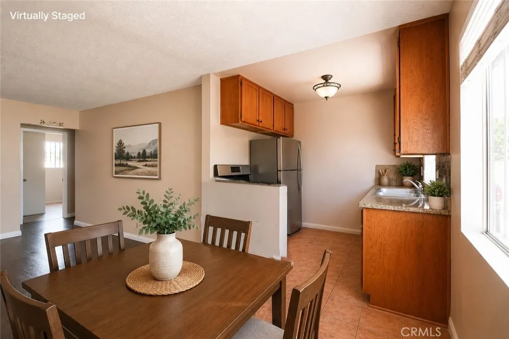 Unit # 481: Dine Area & Kitchen. Virtually Staged