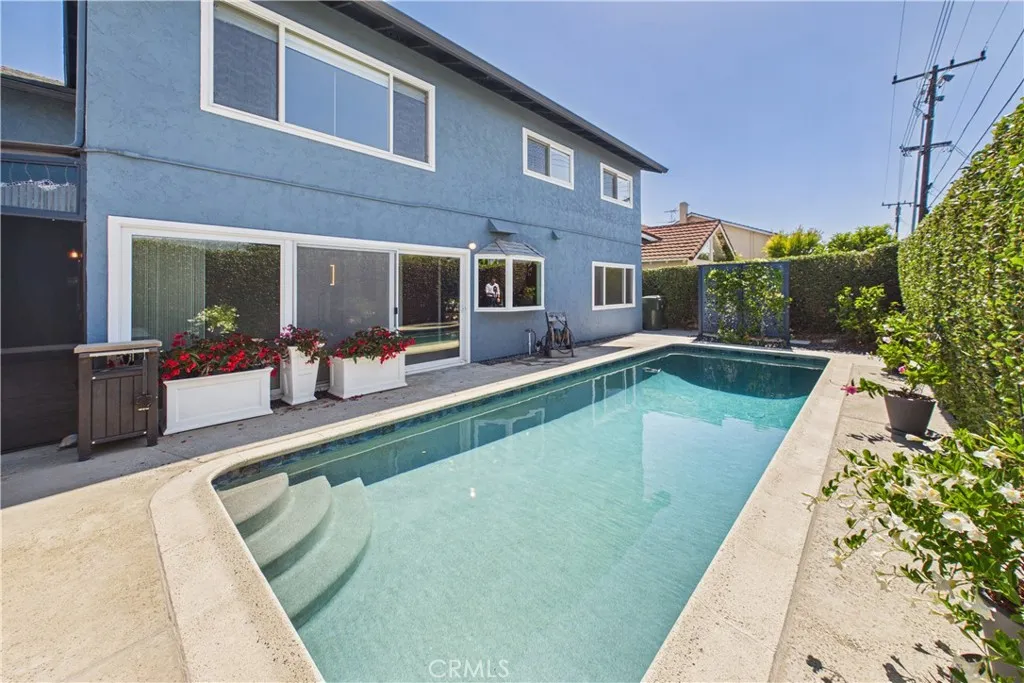 Familiy room sliding glass door allows for quick access to the pool and immense views