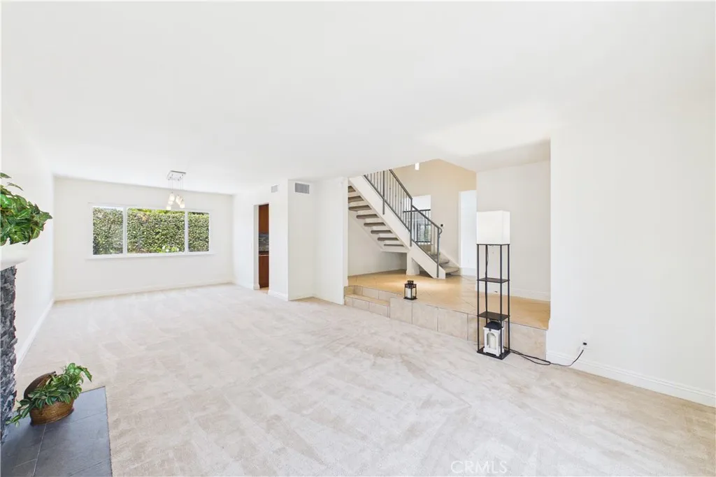 Living room leads to the dining room at the rear of the home