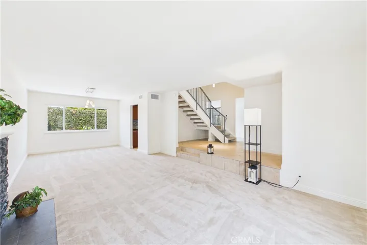 Living room leads to the dining room at the rear of the home