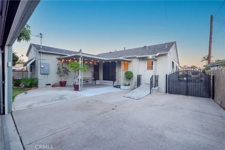 view of the back of the house behind gate