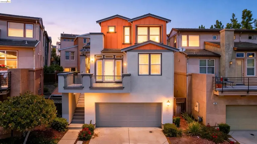 Multi-level contemporary exterior with an attached garage