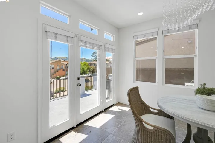 Bright interior space with full-light patio doors and transom windows