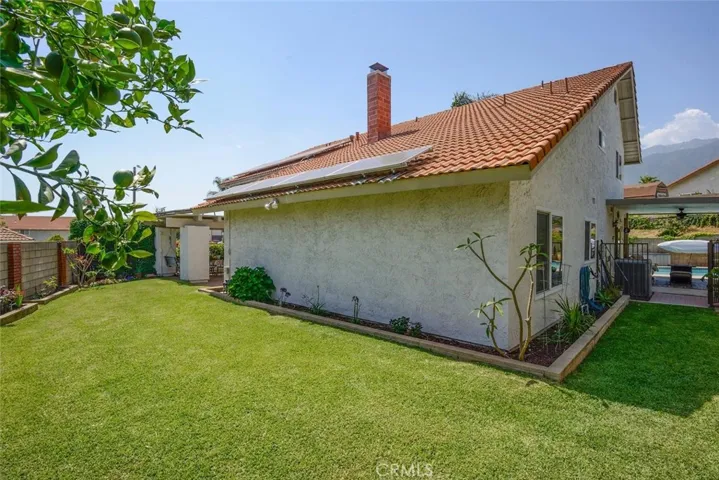 Side yard leading to pool/spa area