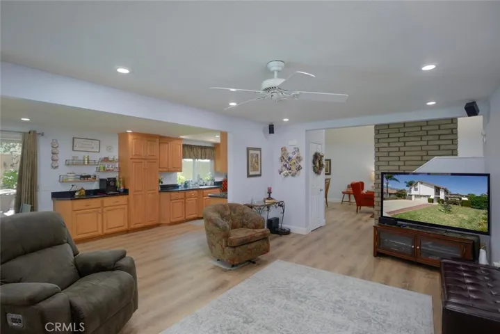Spacious, open view of family room, kitchen which flows into living/dining areas
