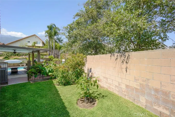 Rear yard leading through cross fencing to pool/spa patio area