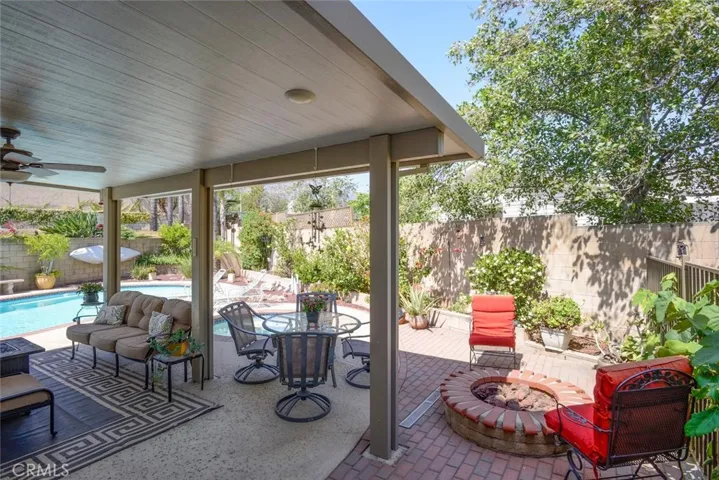 Relaxing patio, firepit, spa, pool and even a bubbling fountain offers all the luxuries of a peaceful environment to call "home"