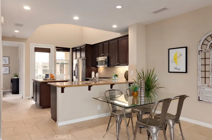 Kitchen opens directly to the living area, allowing for easy entertaining and connected living.