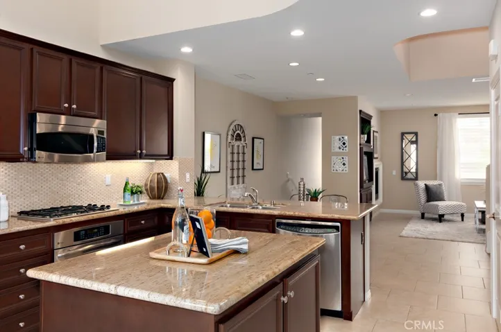 Large center island creates the perfect gathering place for casual dining and entertaining guests.