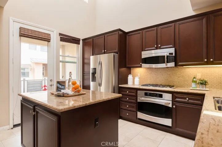 Beautiful gourmet kitchen featuring granite countertops, stainless steel appliances, and abundant cabinet space.