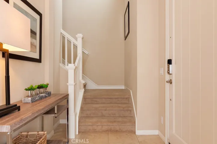 Bright and inviting foyer with upgraded finishes that immediately feels like home.