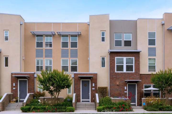 Stunning contemporary townhome offering exceptional curb appeal in the highly sought-after Vantis community.