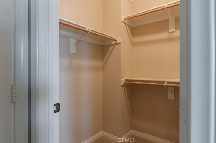 Spacious walk-in closet provides excellent organization and abundant storage space.
