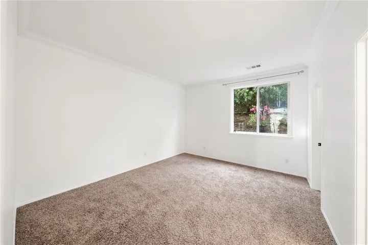 Same bedroom, not staged. Downstairs.