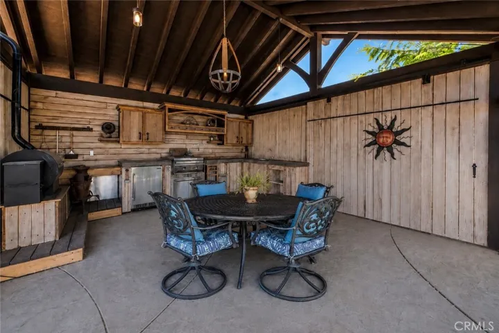 Exceptional poolside outdoor kitchen.
Photo has been virtually enhanced