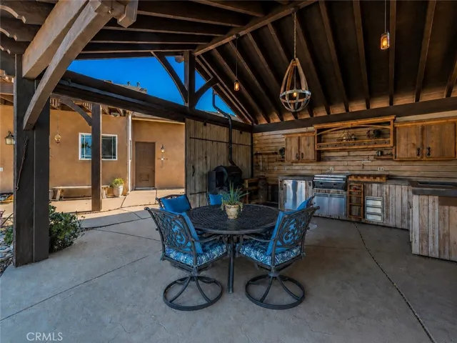 Outdoor poolside kitchen from another angel.
Photo has been virtually enhanced