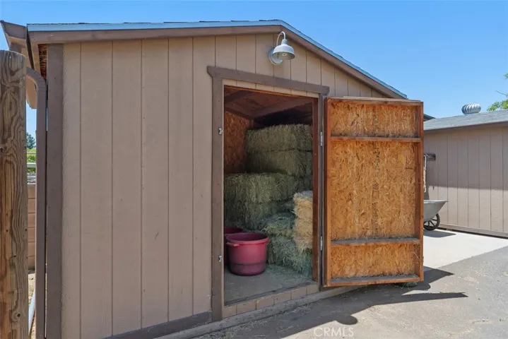 Feed storage room with lighting & rain gutters