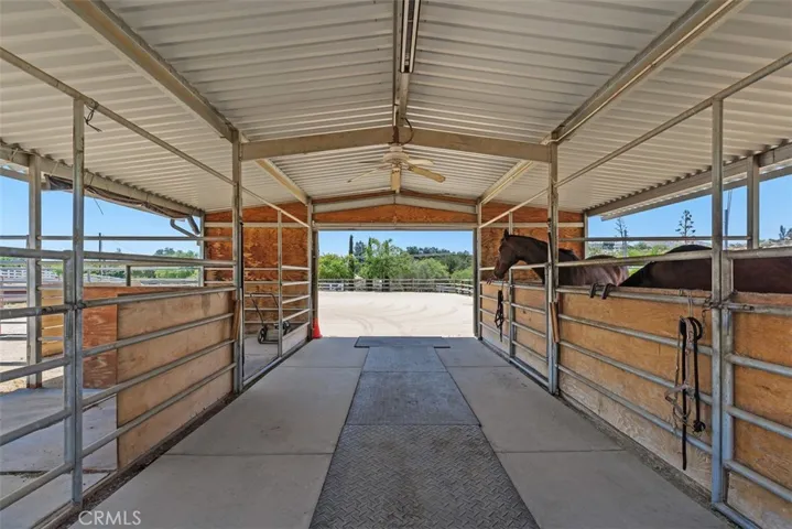 Barn breezeway leading to sand arena