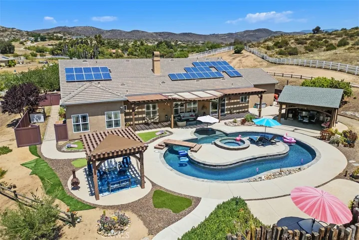 Resort style pool, Arbor & covered outdoor kitchen