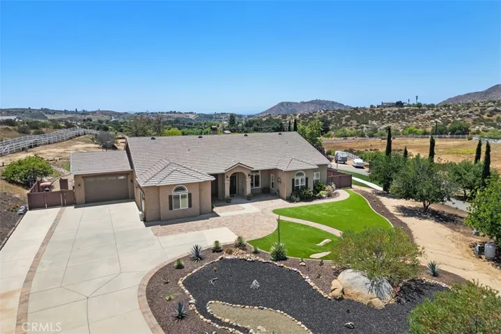 Beautiful front landscaping with artificial turf, rock-scape & mature tree's