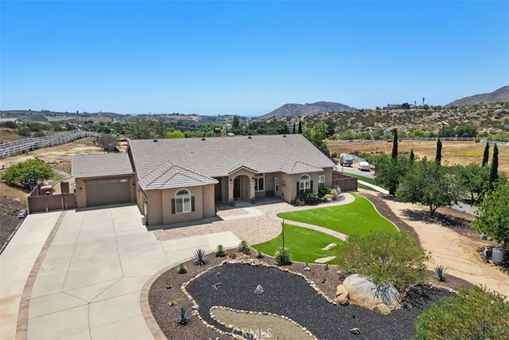 Beautiful front landscaping with artificial turf, rock-scape & mature tree's